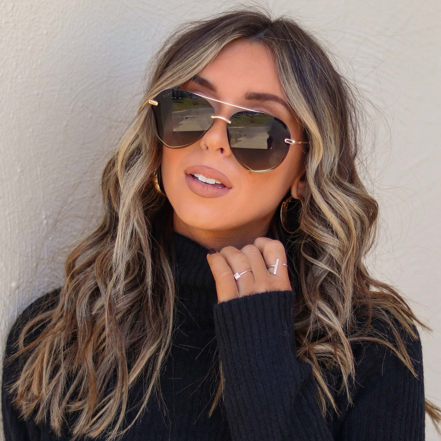 lifestyle - hayleyalaines wearing diff eyewear lenox aviator sunglasses with a gold, black metal frame and grey gradient polarized lenses