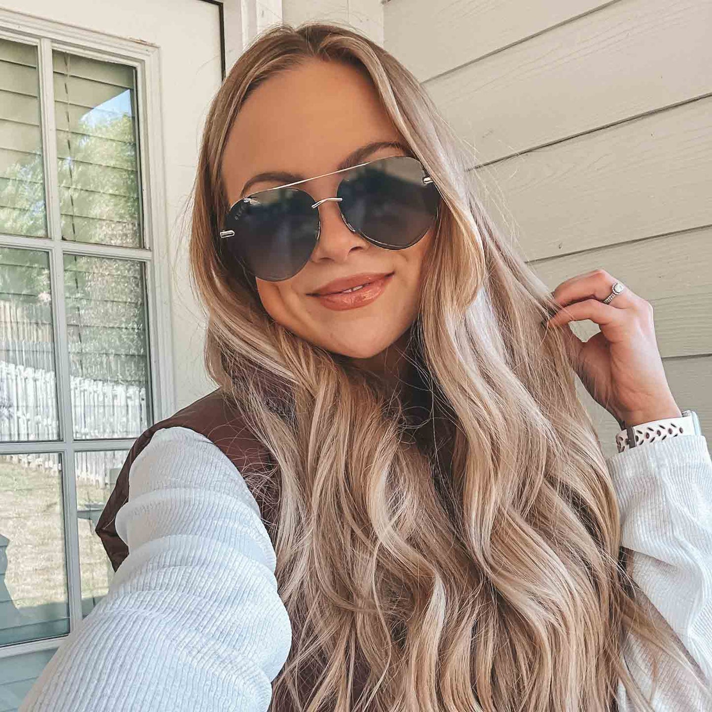 customer content - kimberlyj king wearing diff eyewear lenox aviator sunglasses with a gold, black metal frame and grey gradient polarized lenses