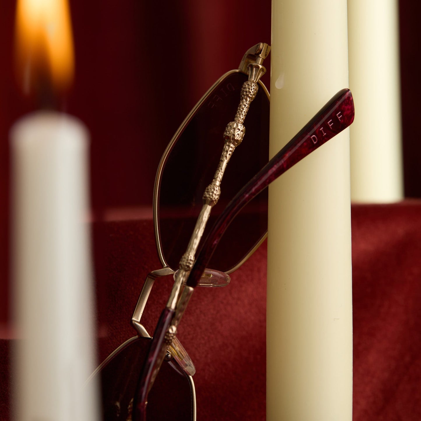 lifestyle - harry potter x diff eyewear featuring professor dumbledore sunglasses with a gold frame and aubergine lenses detailed view