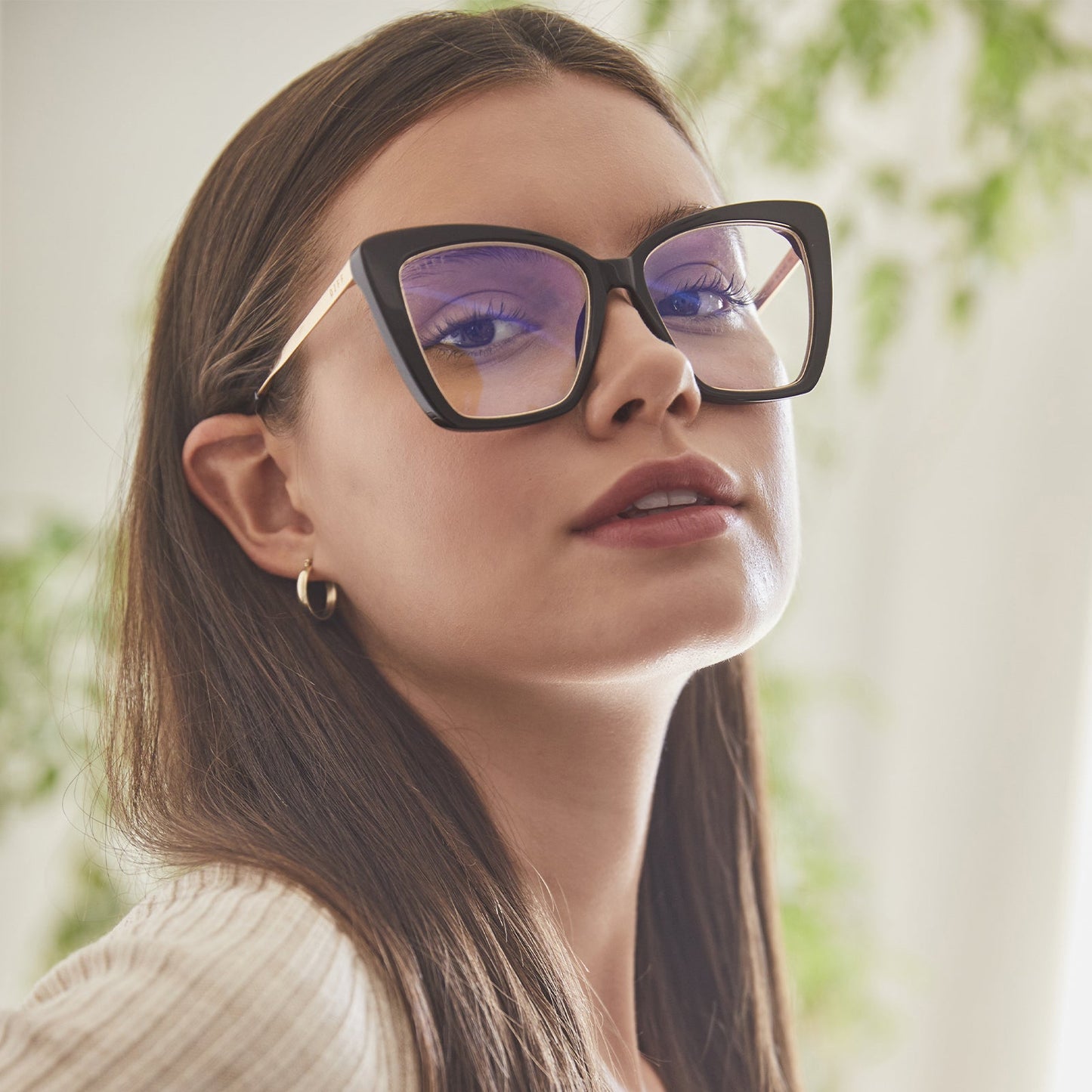 lifestyle - brunette model wearing becky iv black with blue light tech