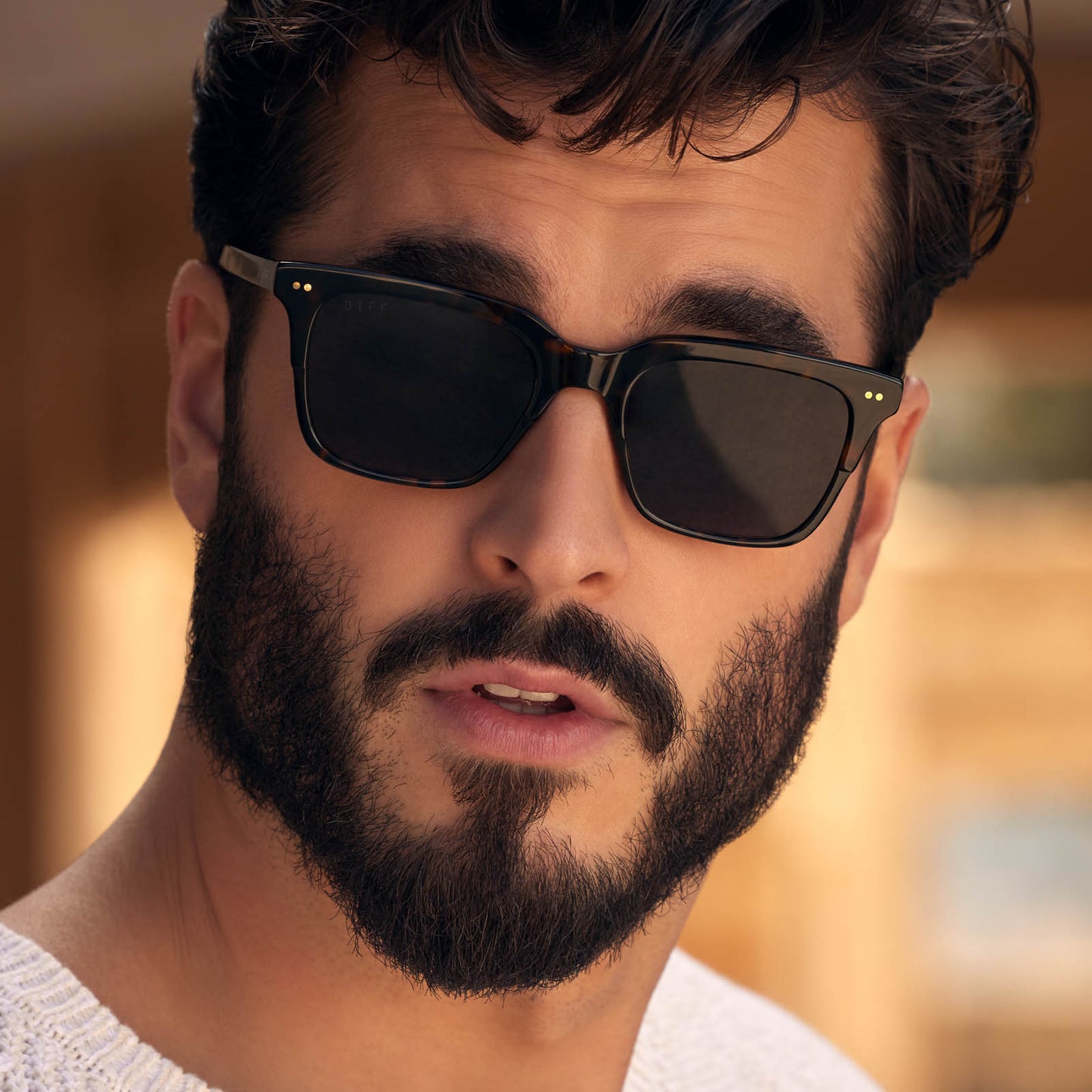 on model - male with surprised look while wearing billie square sunglasses with a shadow tortoise acetate frame and grey polarized lenses