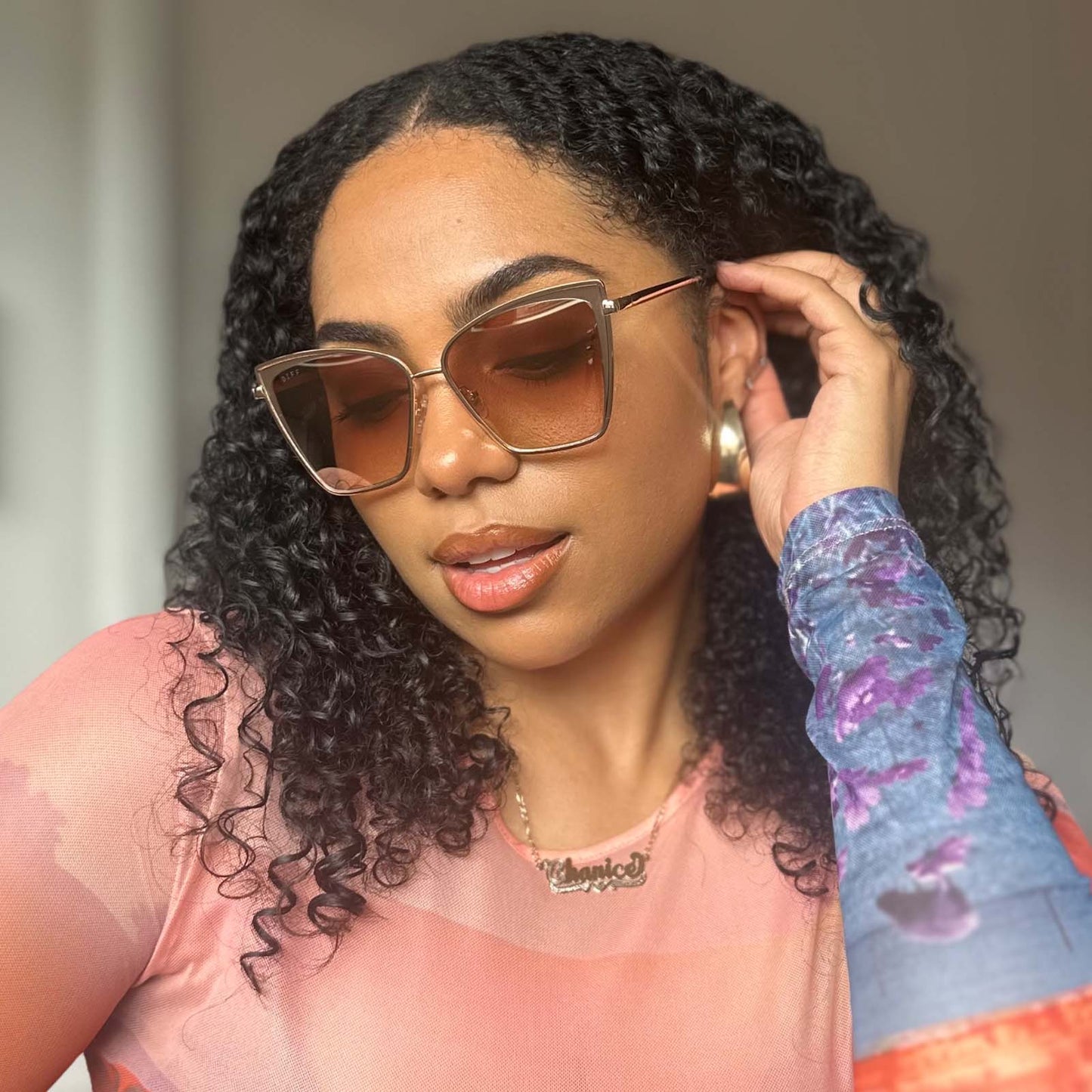 customer content - female wearing diff eyewear becky cat eye sunglasses with a gold frame and flash brown gradient lenses