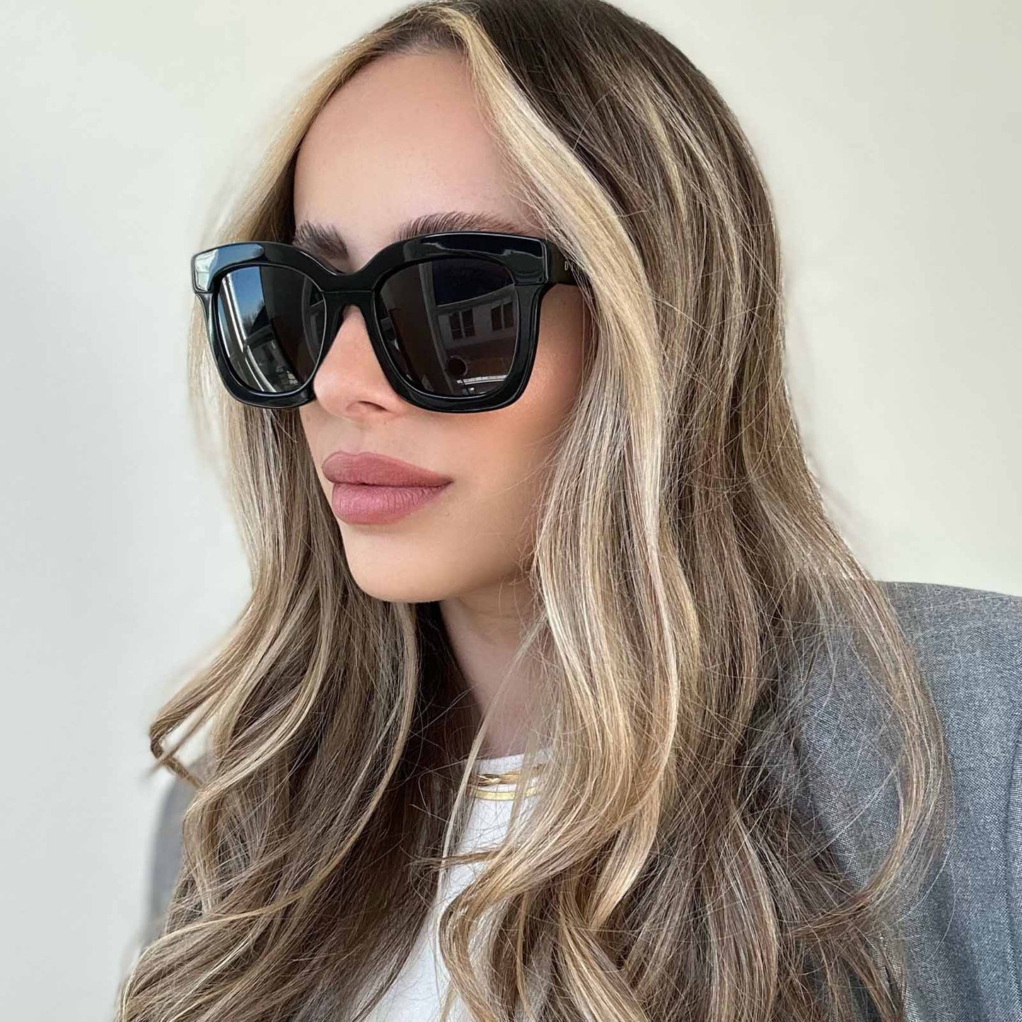 lifestyle - blonde female wearing Carson Black Dark Smoke Polarized sunglasses