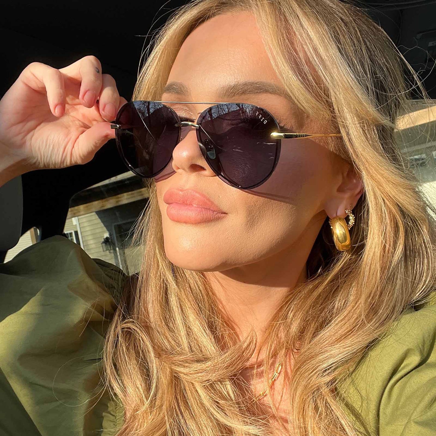 customer content - blonde female wearing diff eyewear lenox aviator sunglasses with a gold metal frame and blue gradient polarized lenses