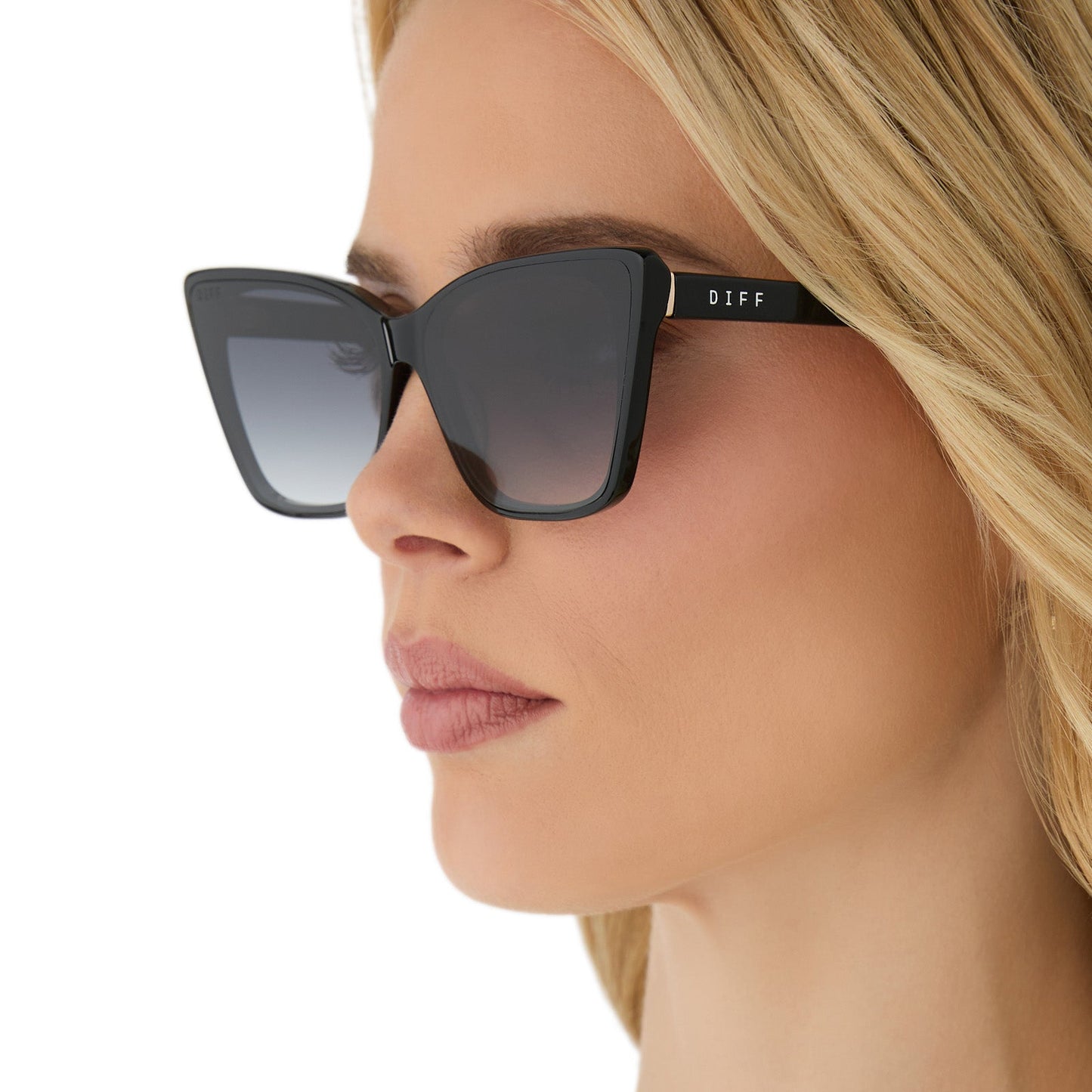 on model - female wearing diff eyewear featuring the alina cat eye sunglasses with a black frame and grey gradient lenses side view