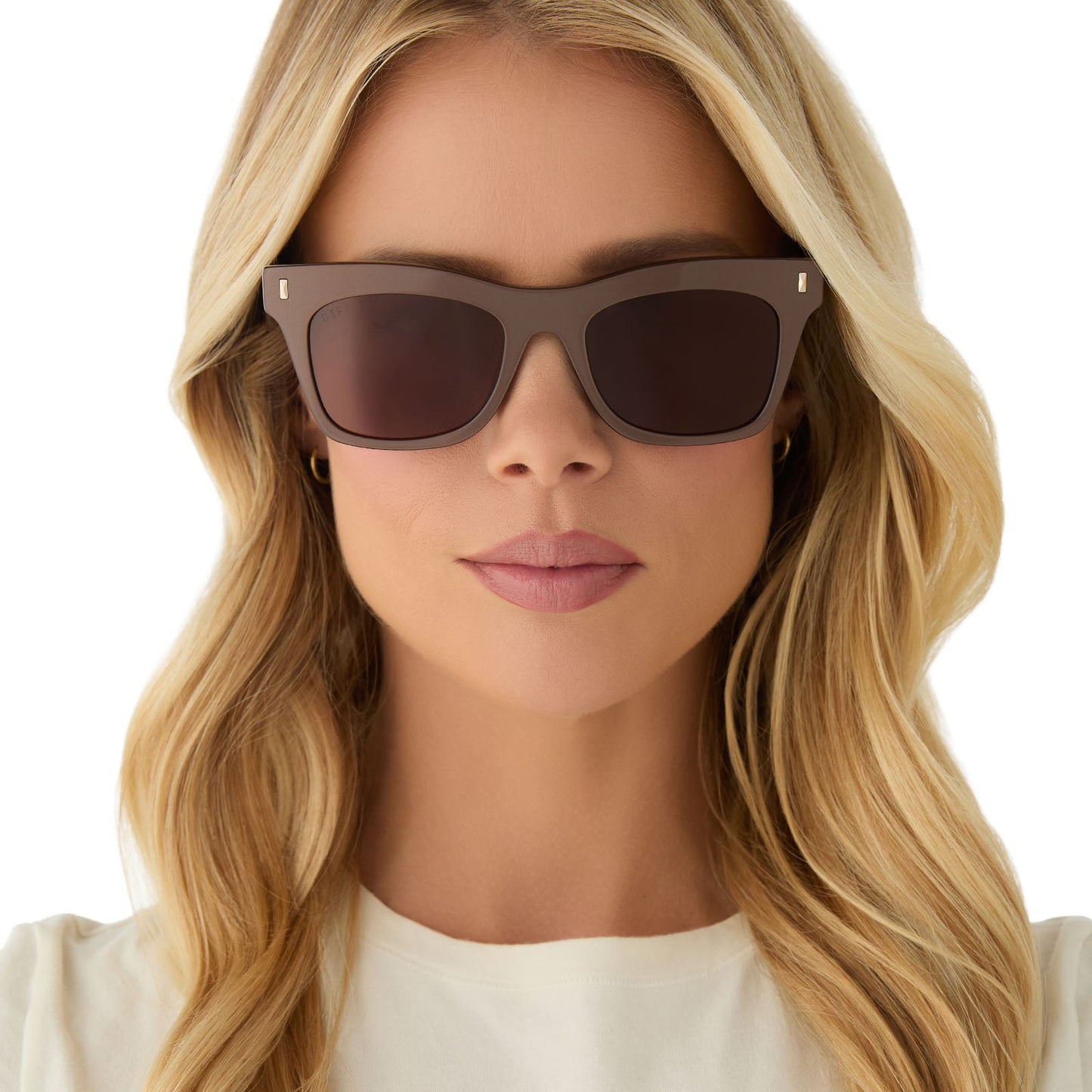 on model - female wearing diff eyewear featuring the bradley cat eye sunglasses with a moscow mule frame and brown lenses front view