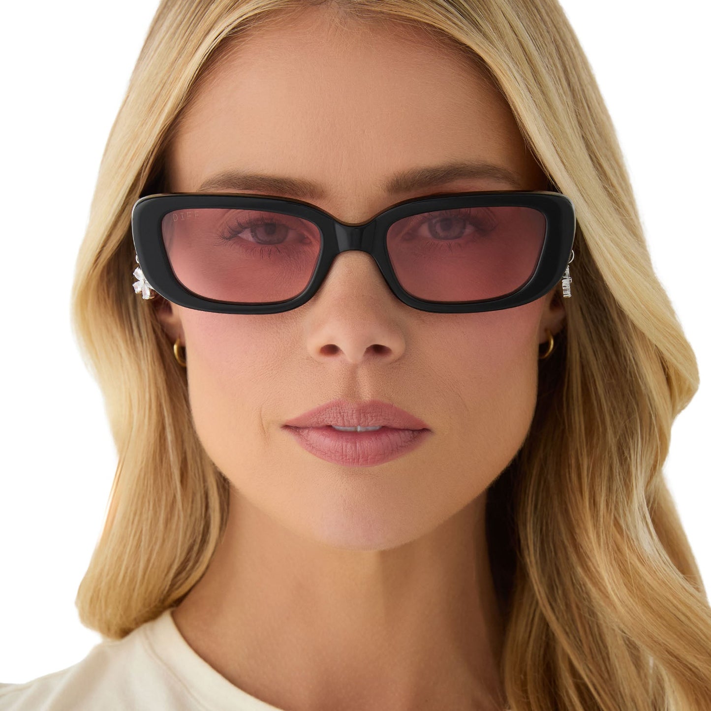 on model - female wearing clueless x diff eyewear featuring the cher round sunglasses with a black frame and pink gradient lenses front view