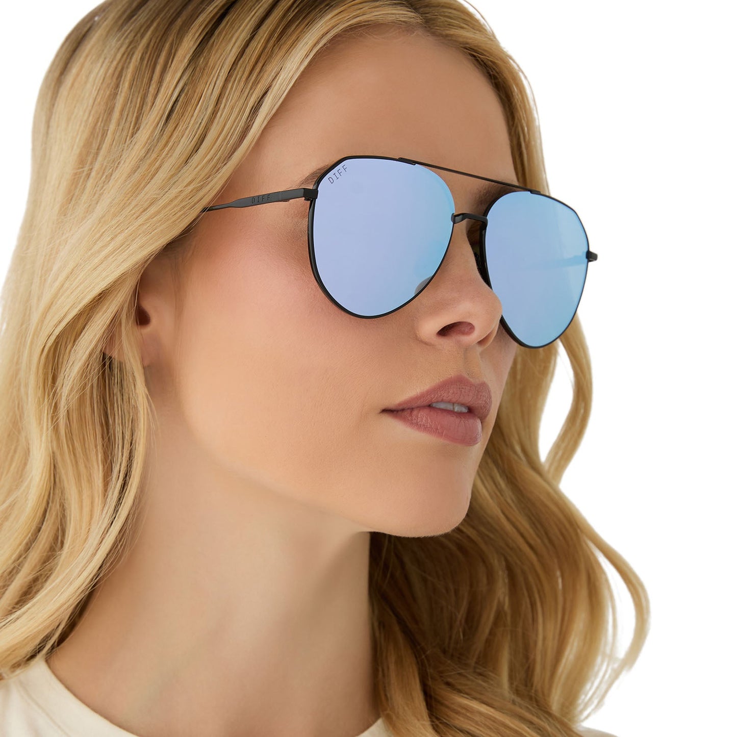 on model - female wearing diff eyewear featuring the dash aviator sunglasses with a black frame and lavender mirror lenses angled view