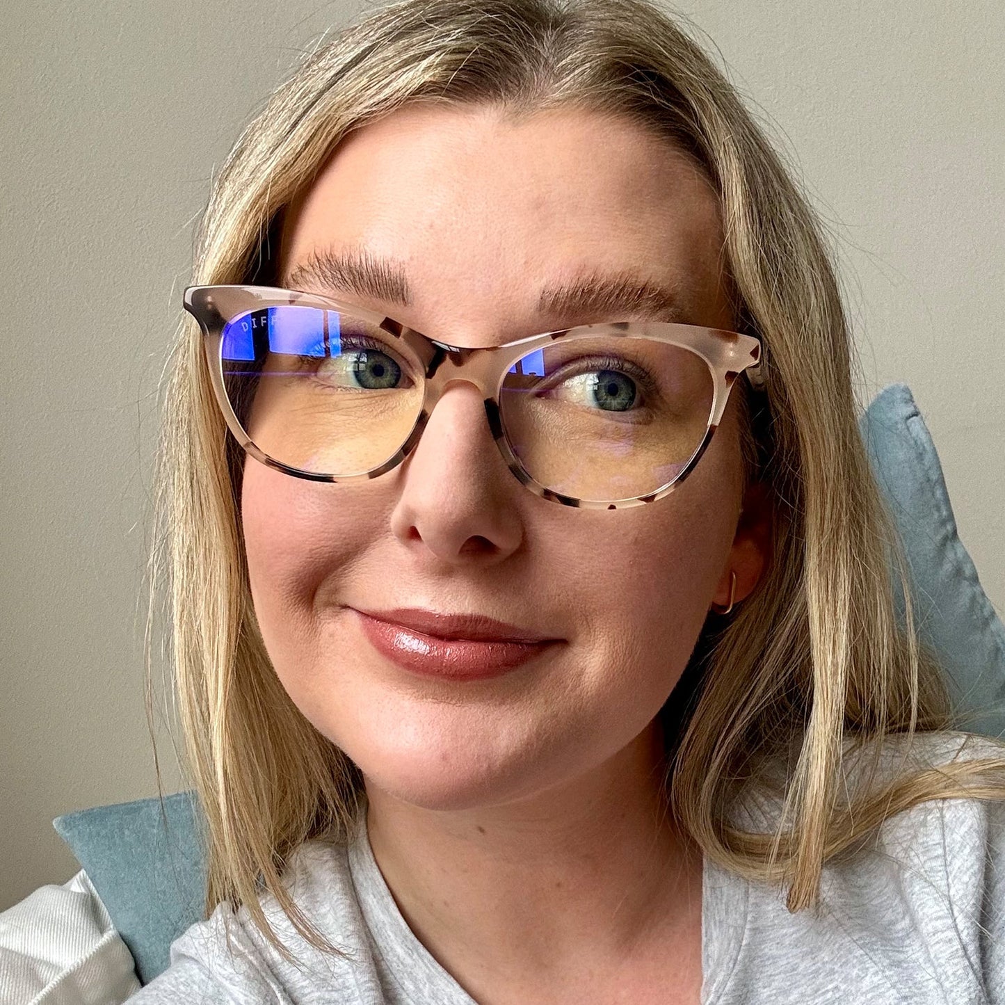 customer content - female wearing Jade cream tortoise prescription front