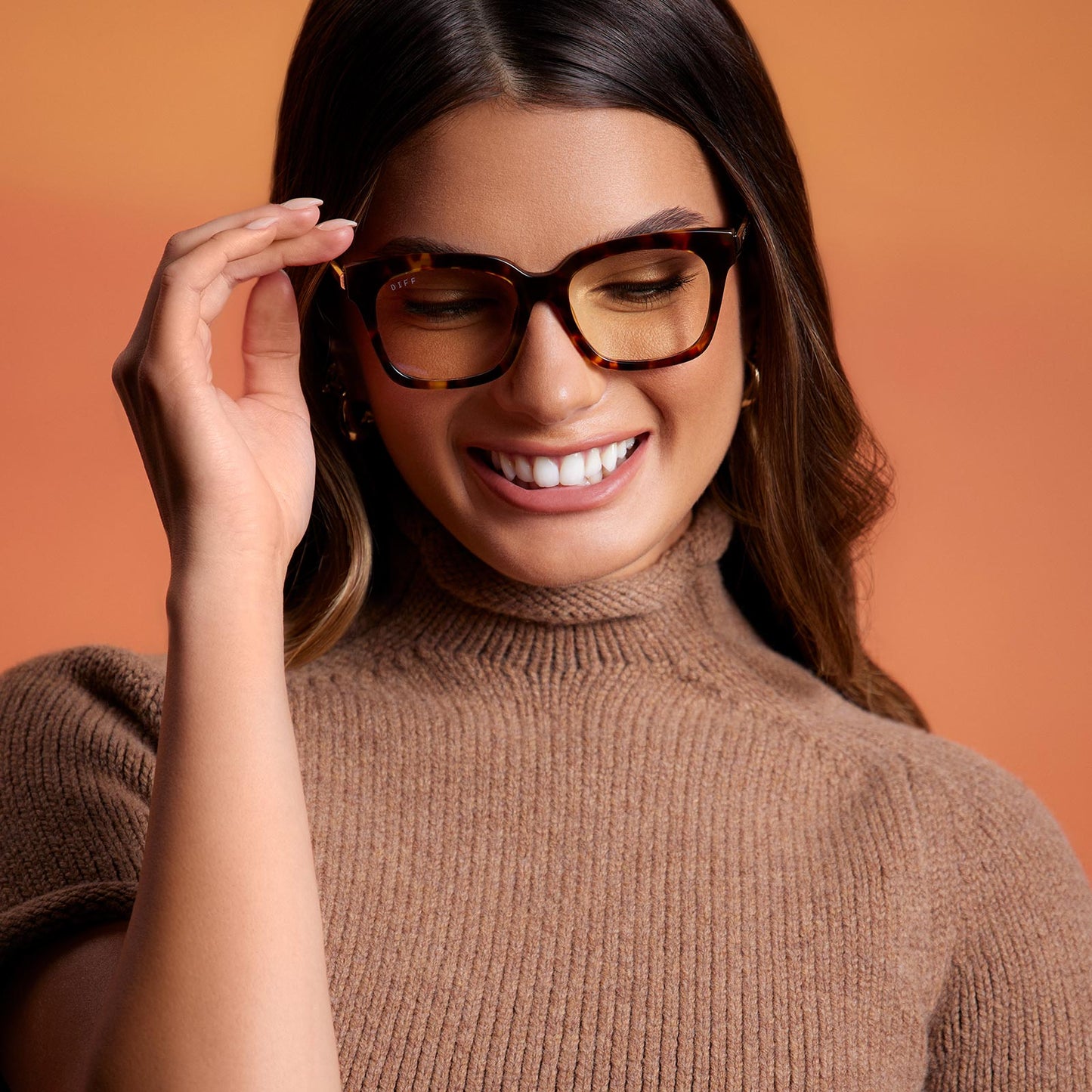 on model - brunette wearing bella xs square eyeglasses with a amber tortoise frame and blue light technology lenses