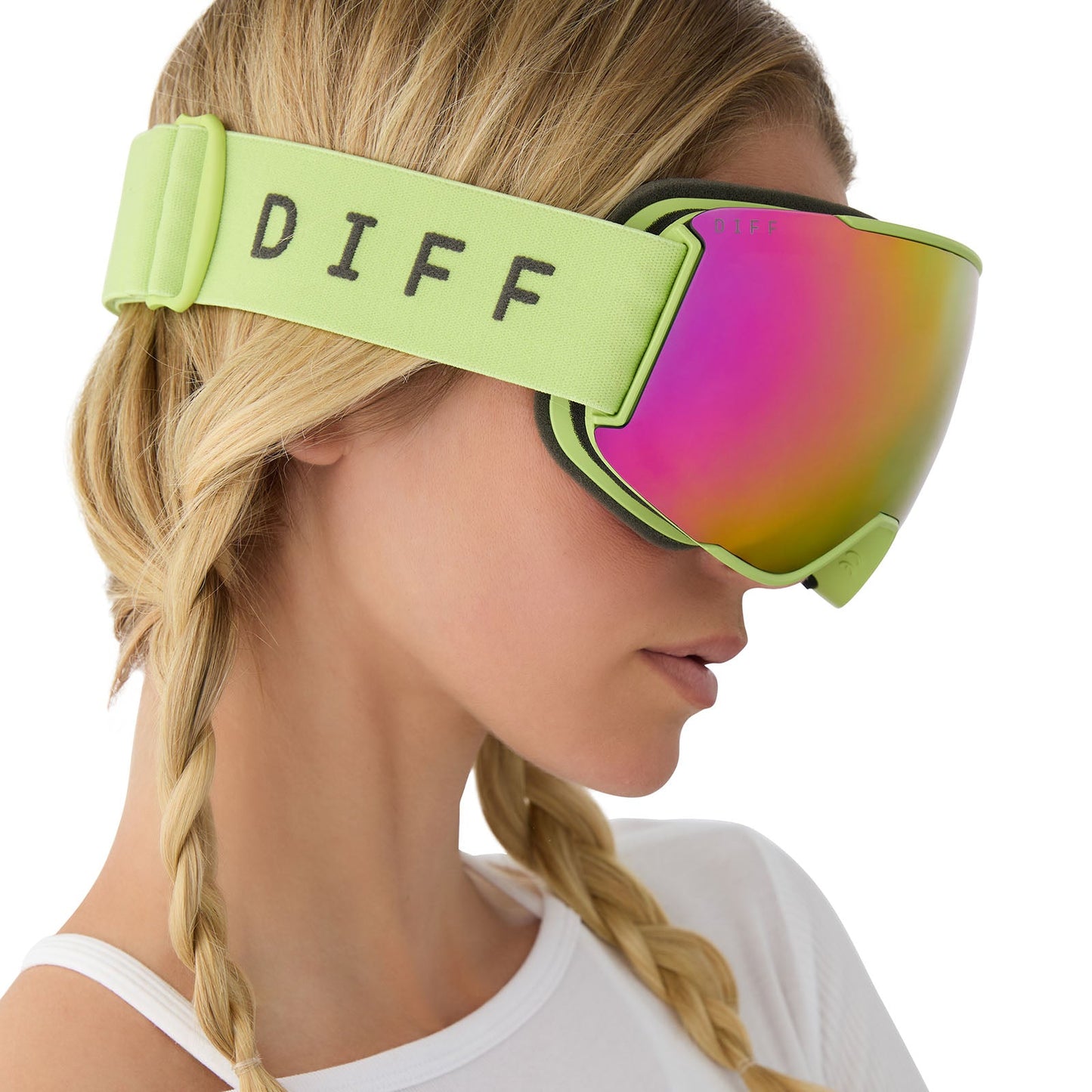 on model - female wearing lifestyle - female wearing diff sport alpine goggles in lime green with hot pink mirror polarized lens side view