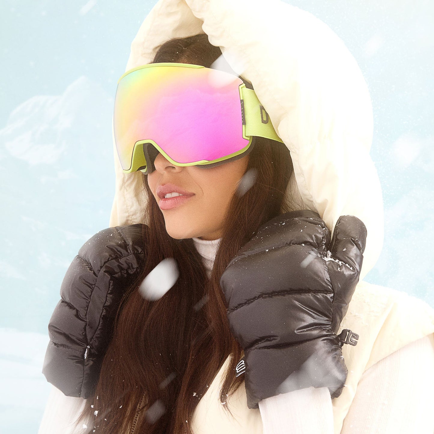 lifestyle - female wearing diff sport alpine goggles in lime green with hot pink mirror polarized lens angled view