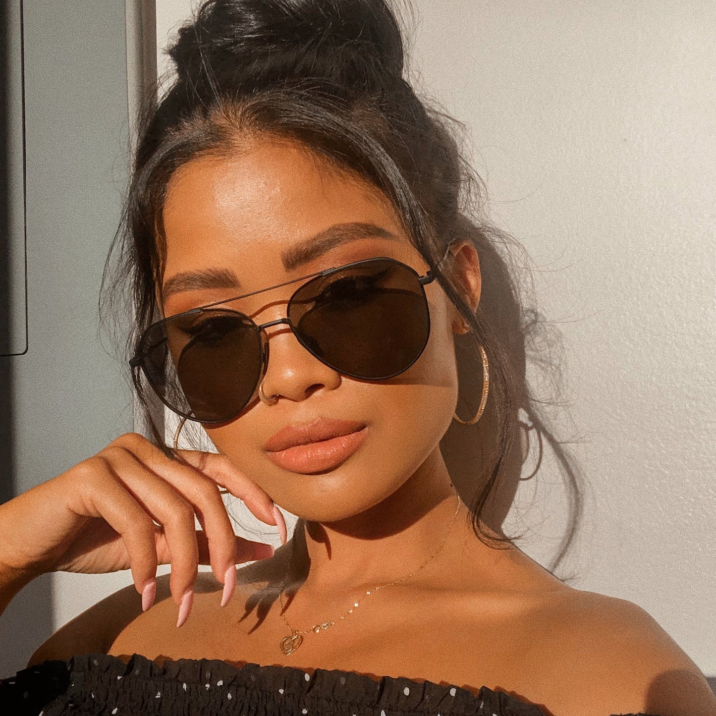 lifestyle - woman wearing the Dash Matte Black and Solid Grey womens aviator sunglasses from DIFF Eyewear