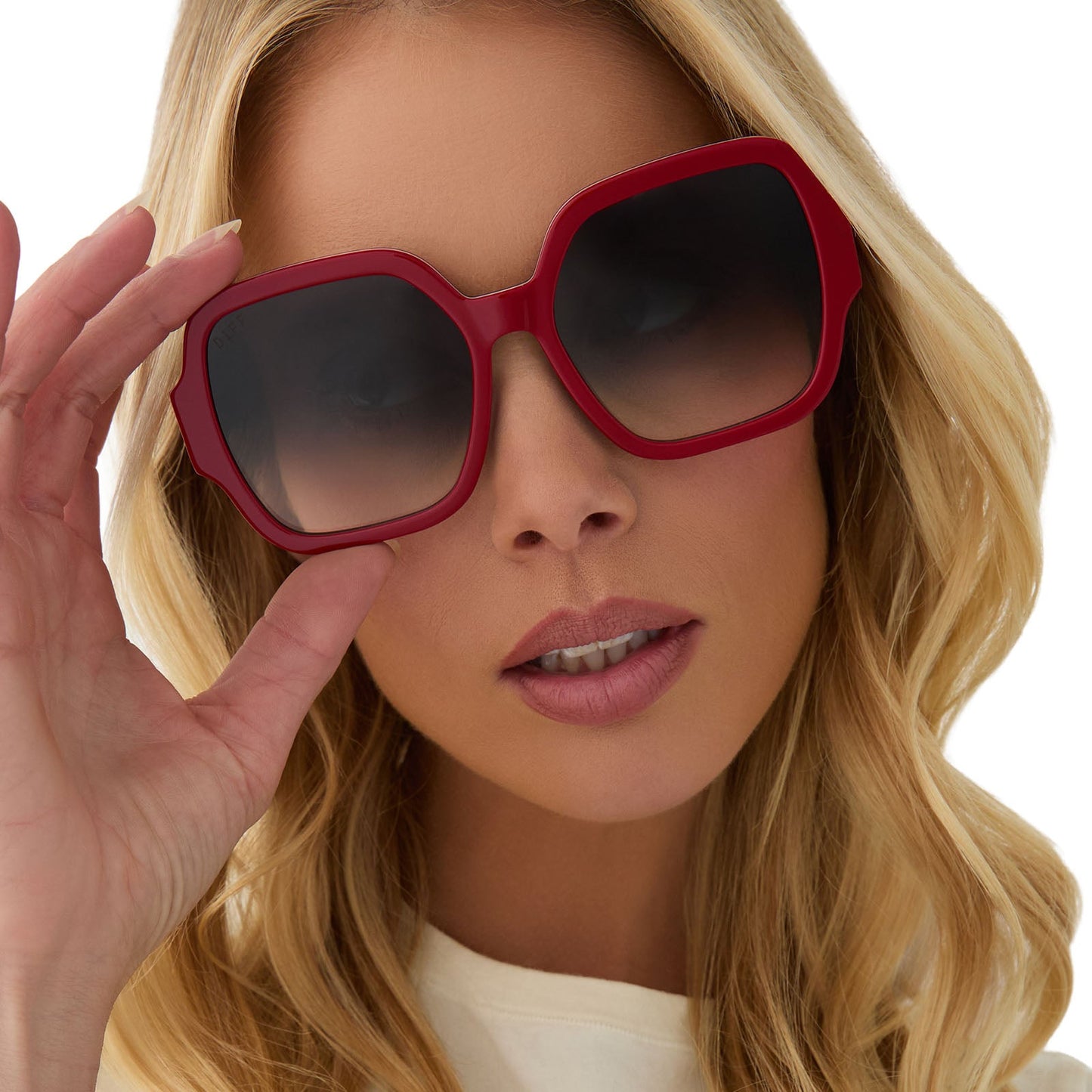 on model - female wearing clueless x diff eyewear featuring the dionne square sunglasses with a red frame and grey gradient lenses front view