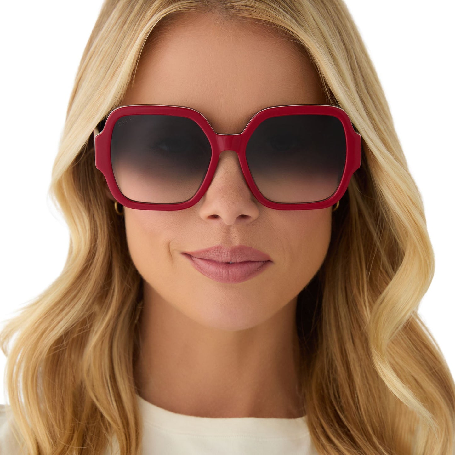 on model - female wearing clueless x diff eyewear featuring the dionne square sunglasses with a red frame and grey gradient lenses front view