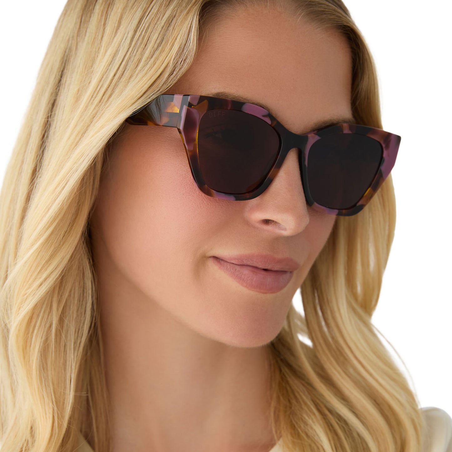 on model - female wearing diff eyewear featuring the evie cat eye sunglasses with a torino tortoise frame and brown lenses angled view