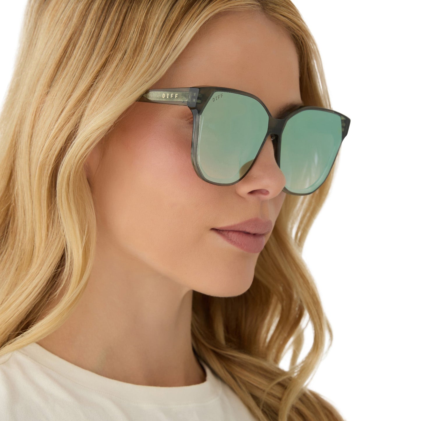 on model - female wearing diff eyewear featuring the gia square sunglasses with a cool matcha green frame and cool matcha mirror lenses side view