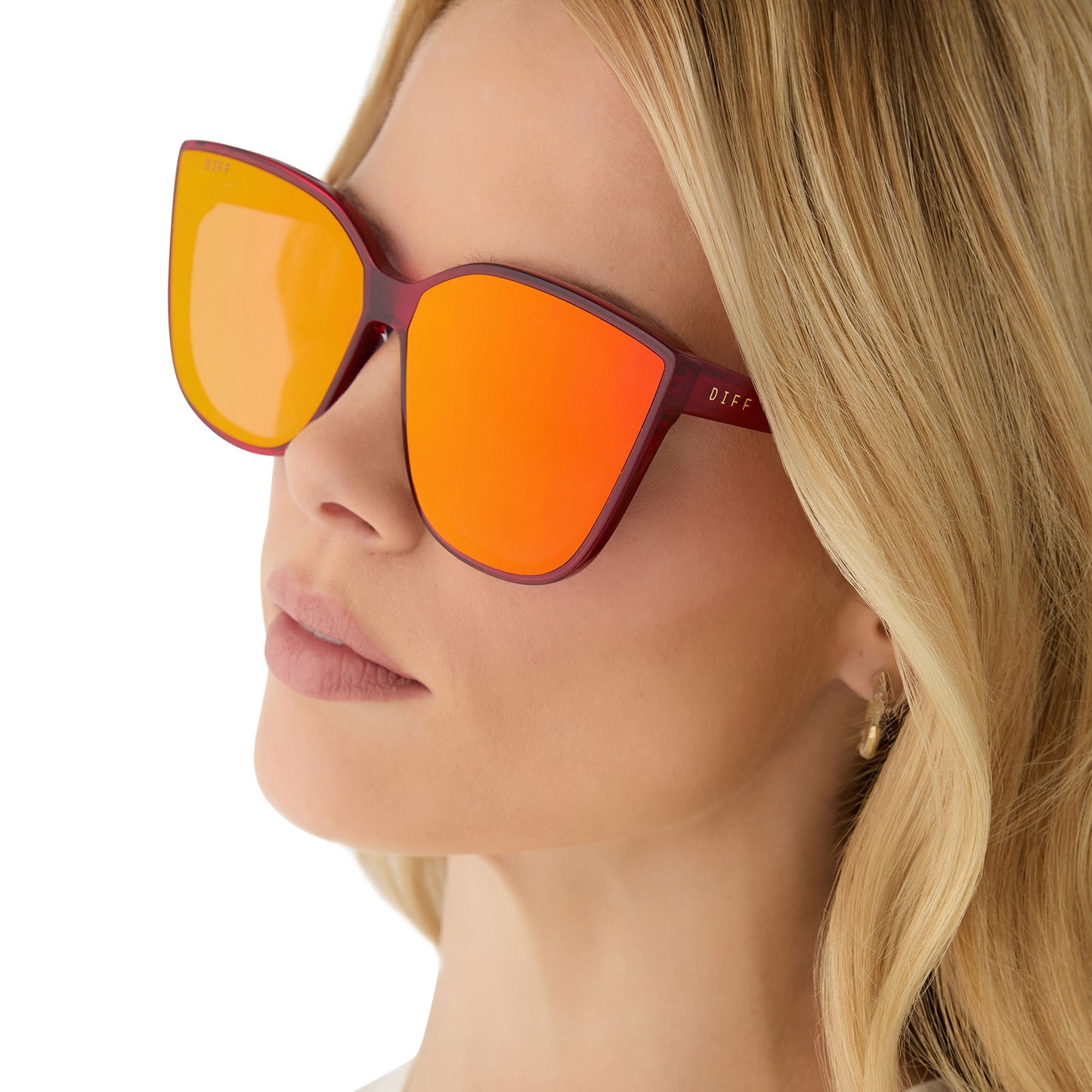 on model - female wearing diff eyewear gjelina cat eye sunglasses with a red hot summer frame and red hot summer mirror lenses side view
