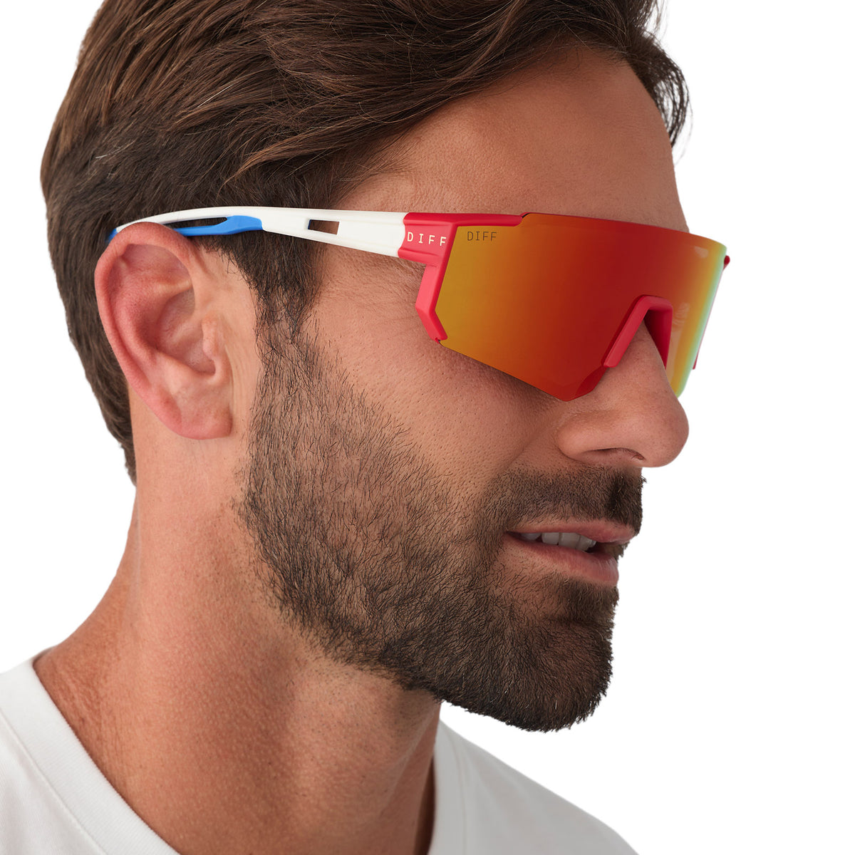 on model - male wearing diff sport featuring the heat shield sunglasses with a firecracker red frame and sunset mirror polarized lenses side view