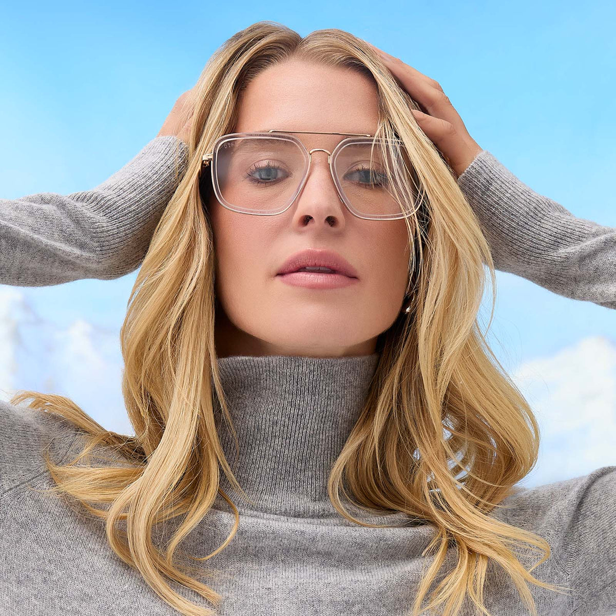on model - female wearing diff eyewear featuring the jordan navigator prescription glasses with a gold frame, clear crystal temple tips front view
