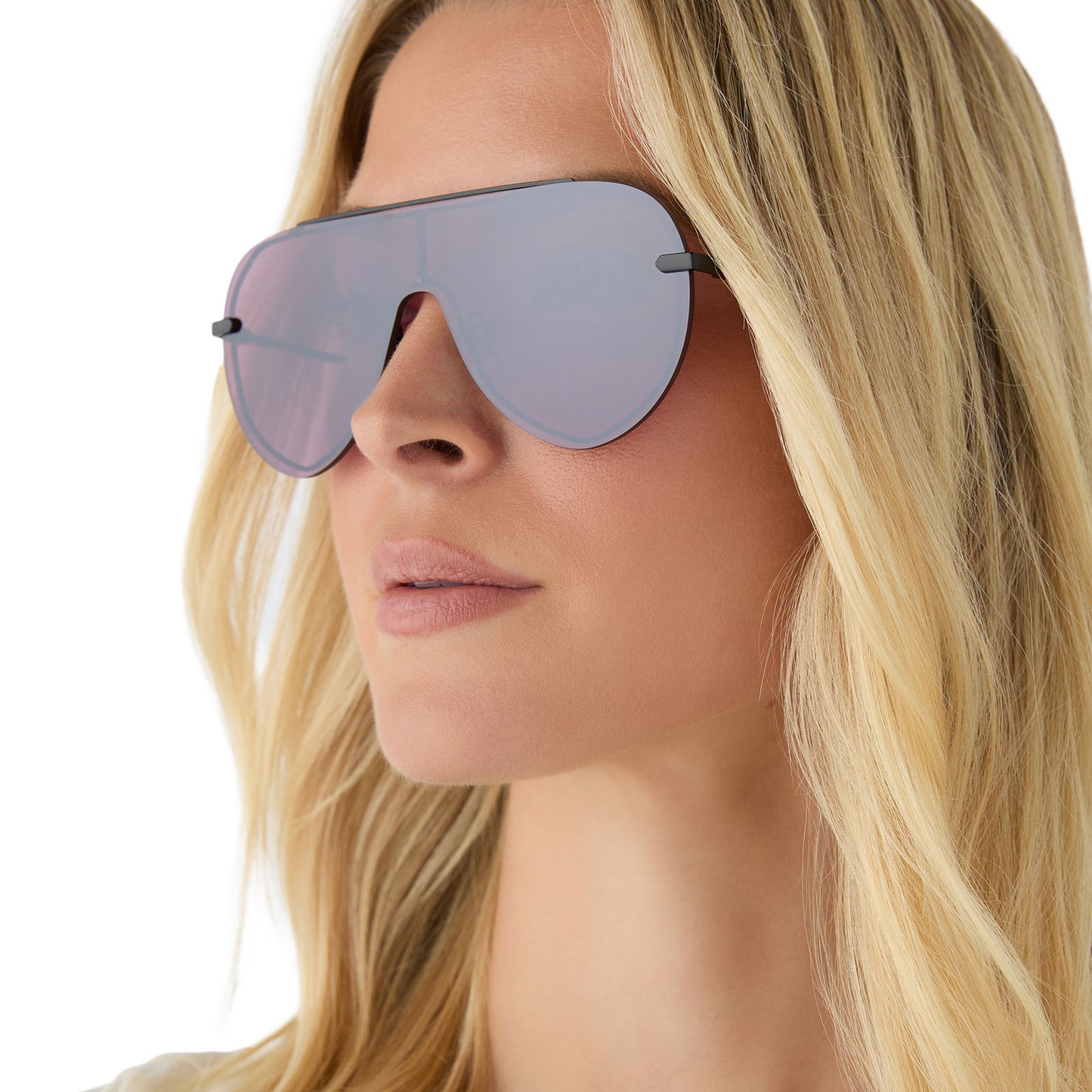 on model - female wearing diff eyewear featuring the imani shield sunglasses with a black frame and aubergine with silver flash lenses angled view