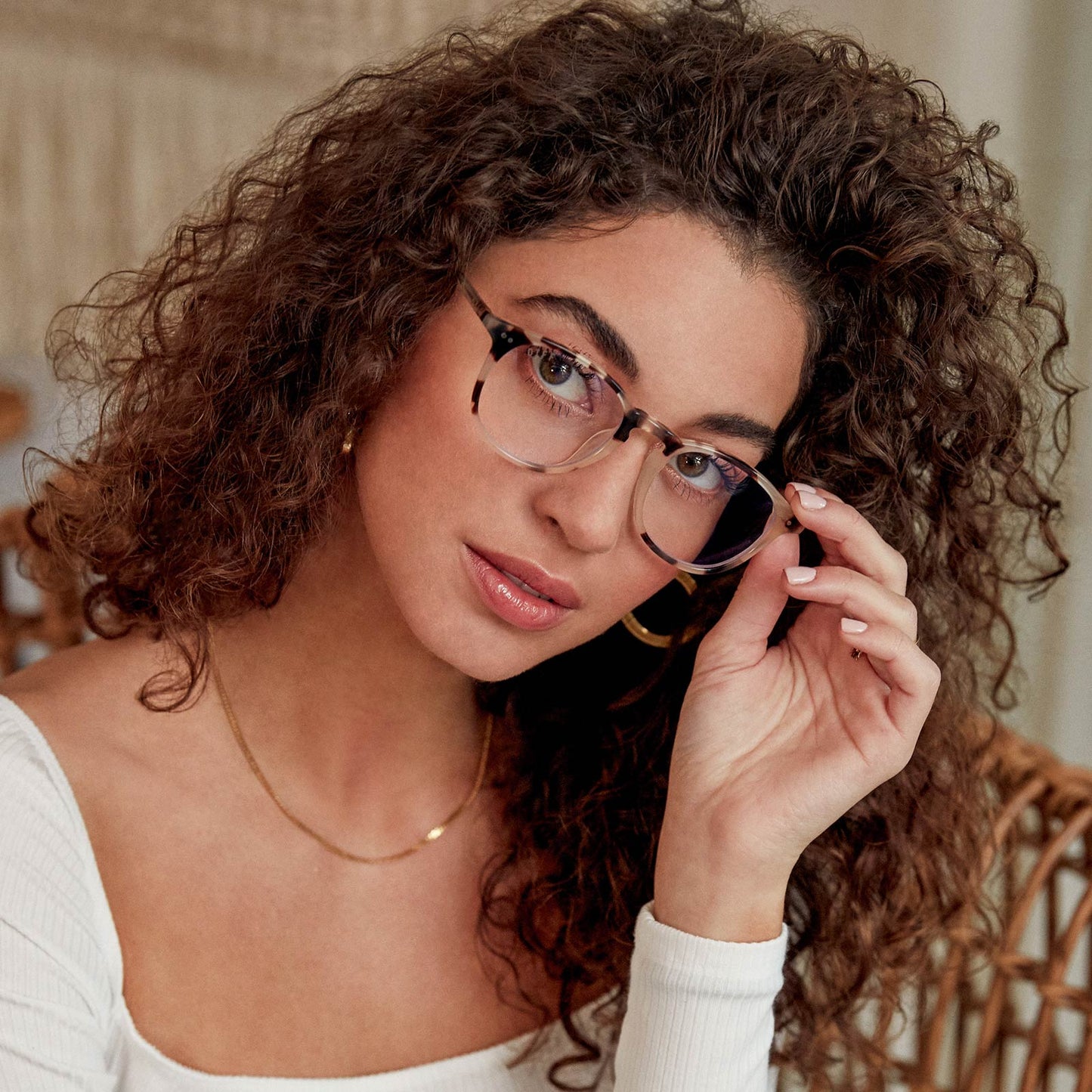 brunette female model wearing jaxson cream tortoise with blue light technology glasses
