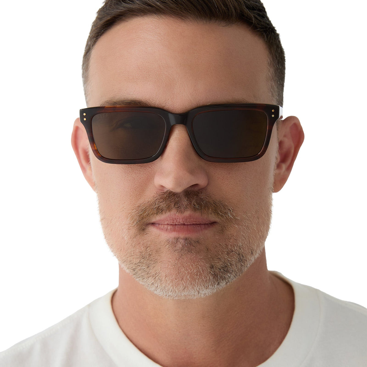 on model - male wearing yellowstone x diff eyewear featuring the john dutton rectangle sunglasses with a sequoia tortoise frame and brown polarized lenses front view