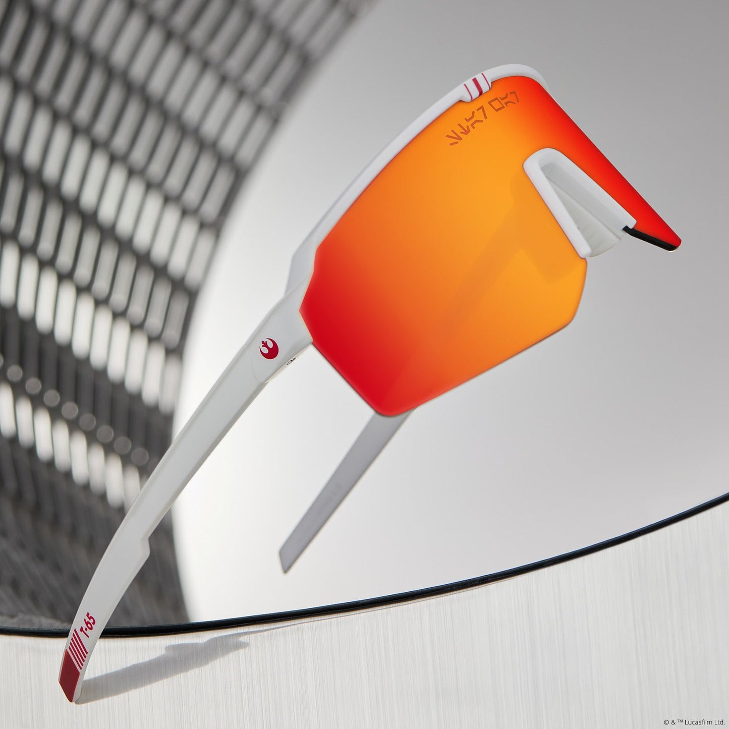 lifestyle - star warsâ„¢ x diff sport featuring the luke x-wingâ„¢ 2.0 shield sunglasses with a white frame and red orange fire mirror polarized lenses angled view