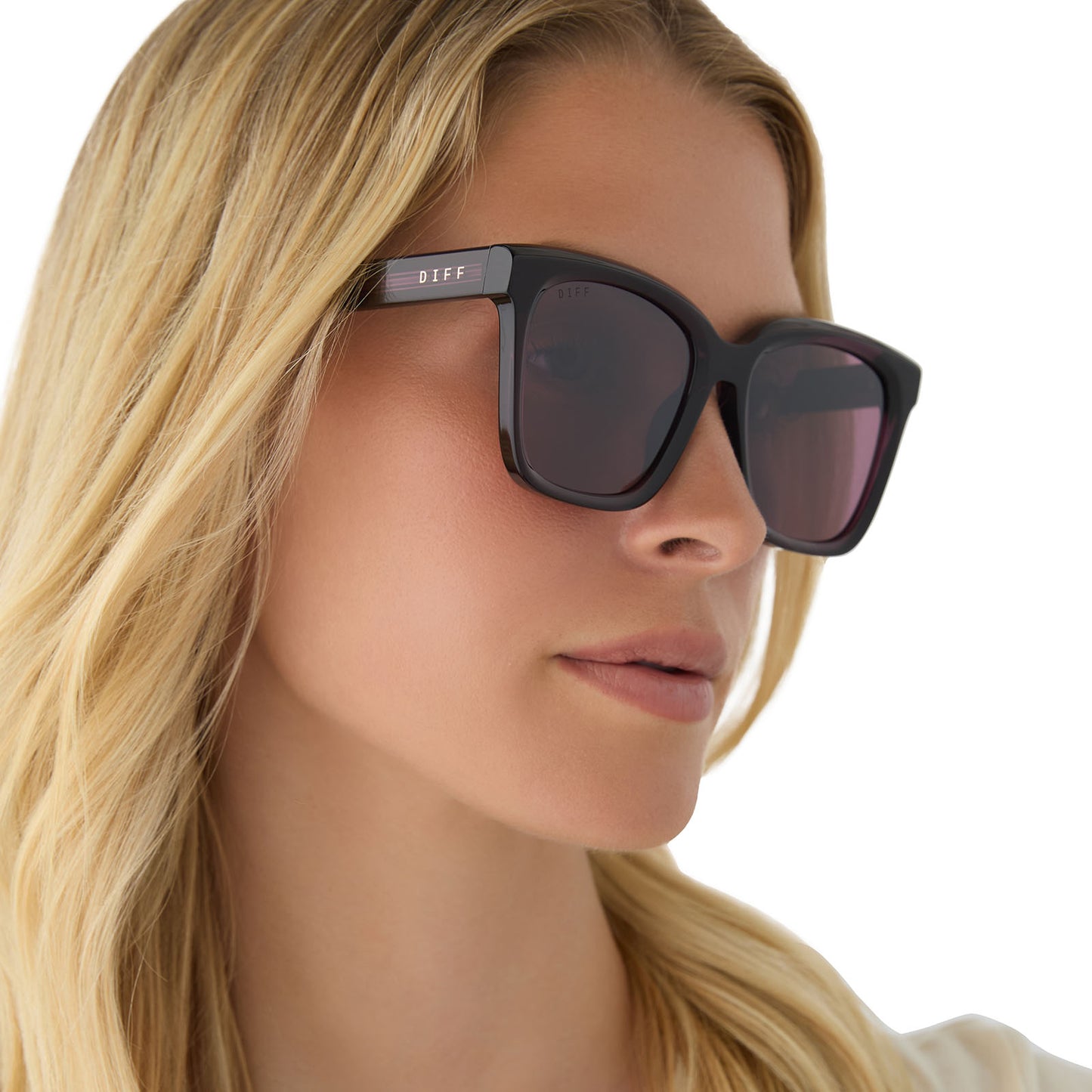 on model - female wearing diff eyewear featuring the meredith square sunglasses with a aubergine purple red frame and aubergine with silver flash lenses angled view
