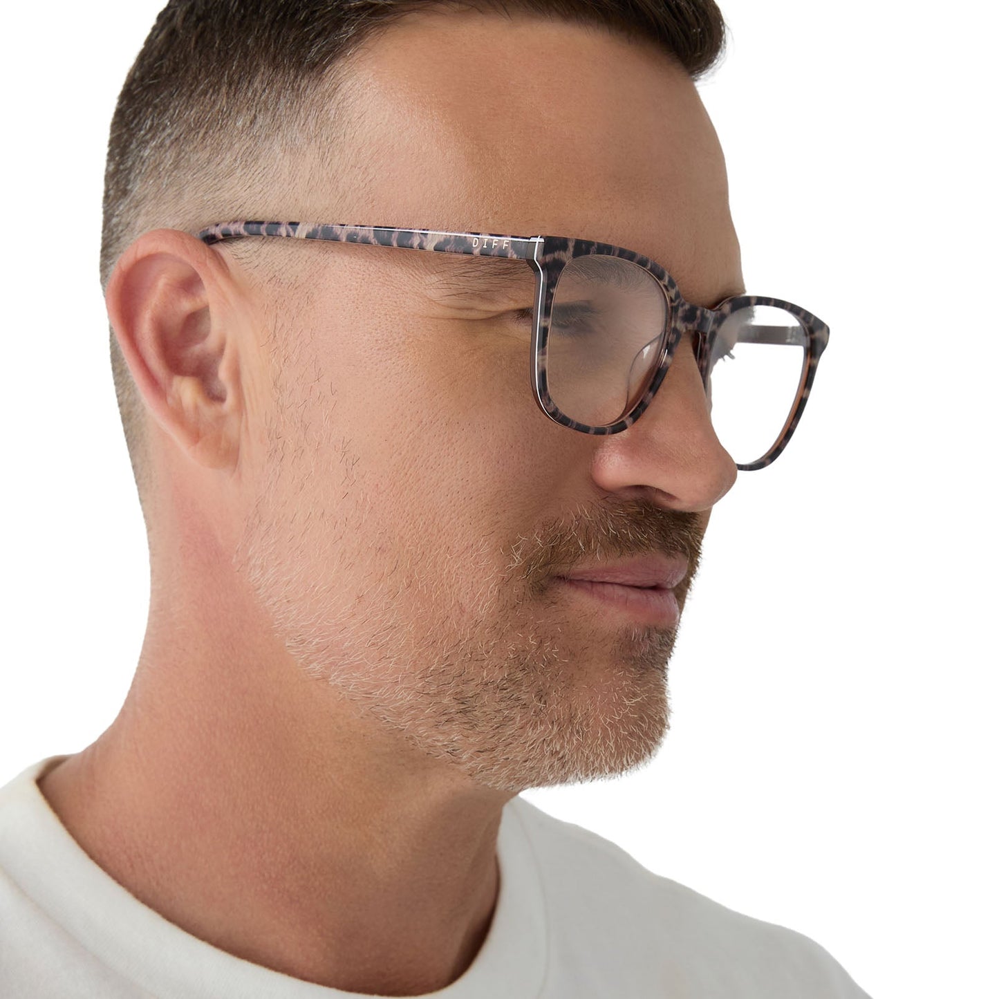 on model - male wearing diff eyewear featuring the parker square prescription glasses with a leopard tortoise frame angled view