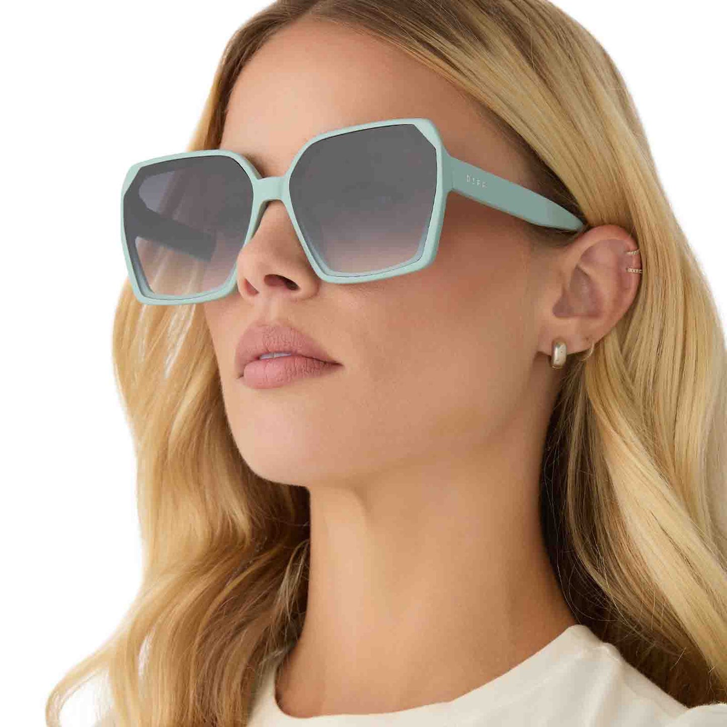 on model - female wearing diff eyewear featuring the presley square sunglasses with a steel teal frame and grey gradient lenses angled view
