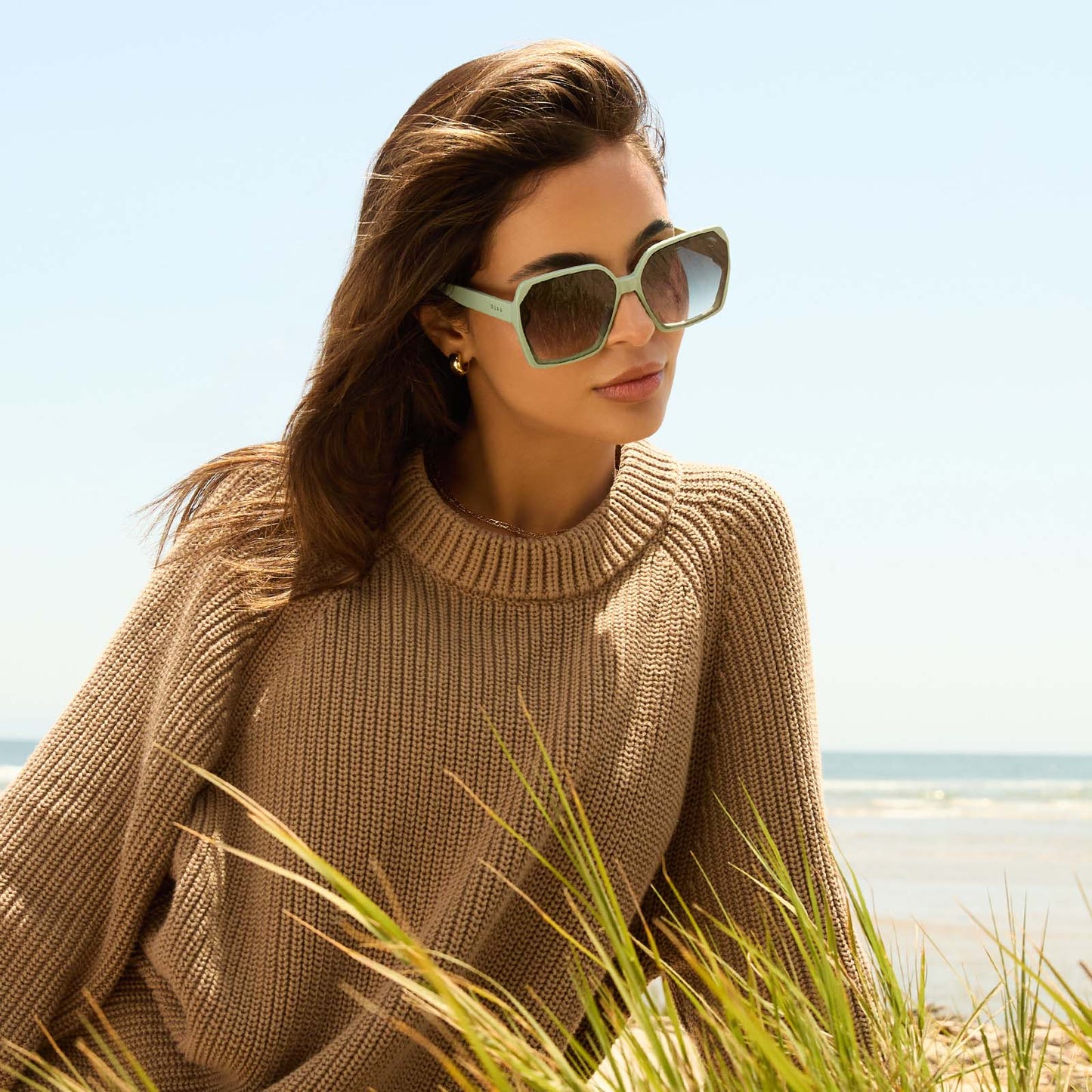 on model - female wearing diff eyewear featuring the presley square sunglasses with a steel teal frame and grey gradient lenses angled view