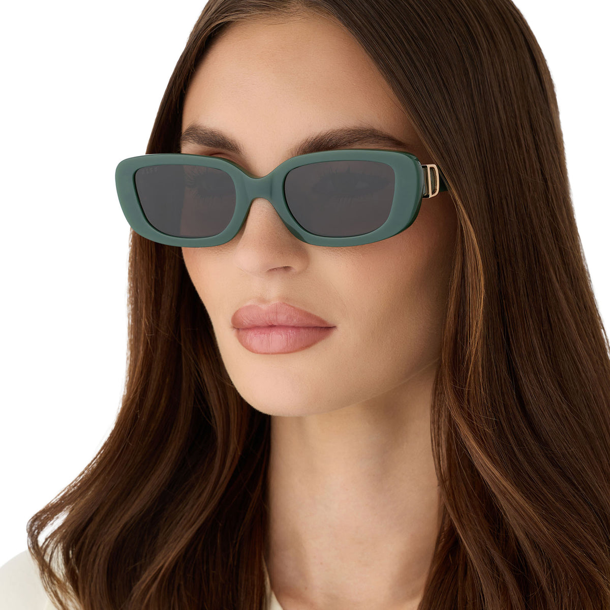 on model - female wearing diff eyewear featuring the daphne rectangle sunglasses with a fairway green acetate frame and grey lenses angled view