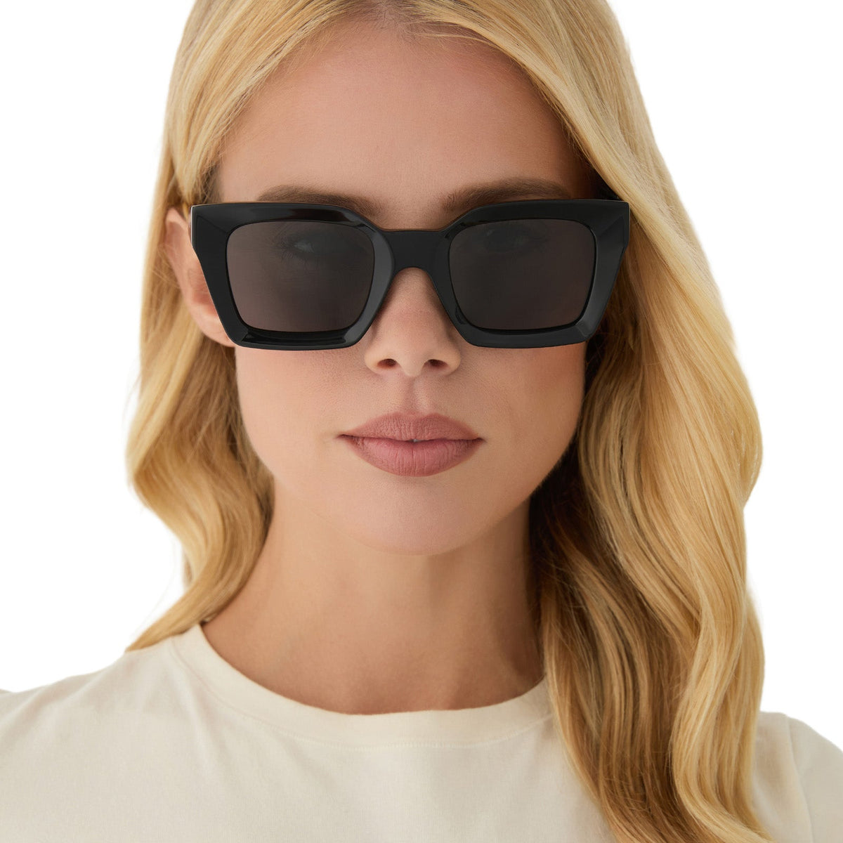 on model - female wearing diff eyewear featuring the greer square sunglasses with a black frame and grey lenses front view