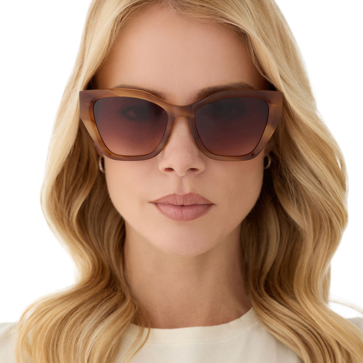 on model - female wearing diff eyewear featuring the evie cat eye sunglasses with a tawny brown tortoise frame and brown gradient lenses front view