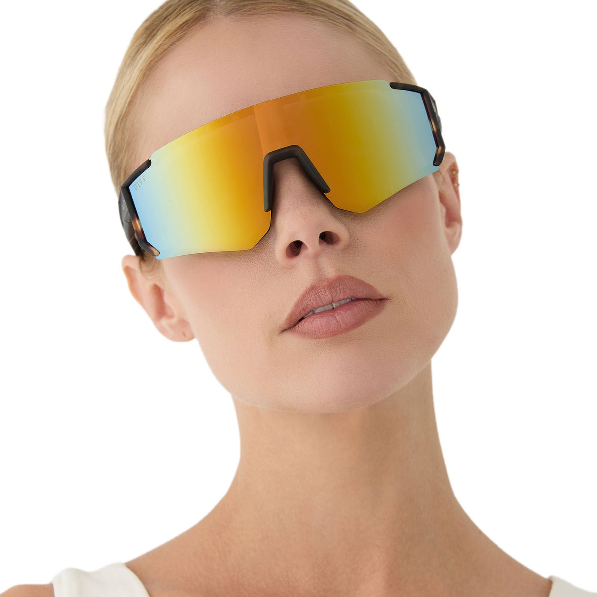 on model - female wearing diff sport featuring the heat shield sunglasses with a sport tortoise frame and orange flash polarized lenses front view