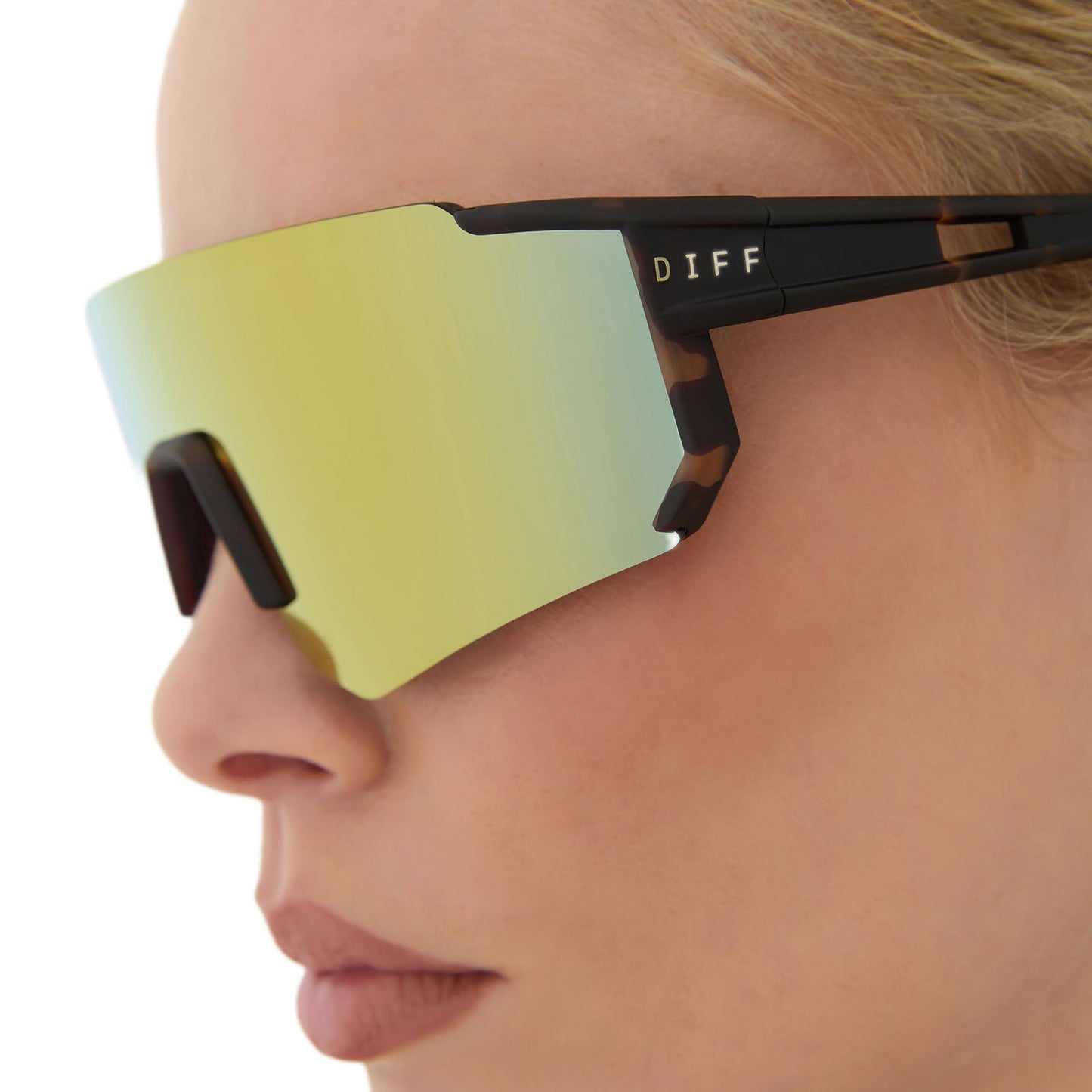 on model - female wearing diff sport featuring the heat shield sunglasses with a sport tortoise frame and orange flash polarized lenses side view