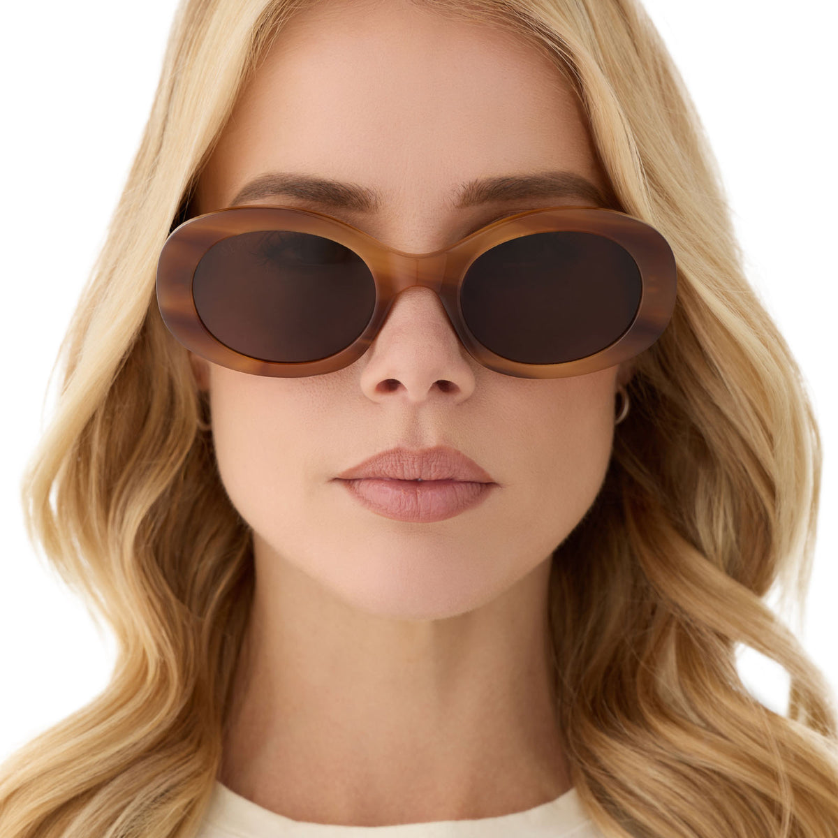 on model - female wearing diff eyewear featuring the lainey oval sunglasses with a tawny brown tortoise frame and brown lenses front view