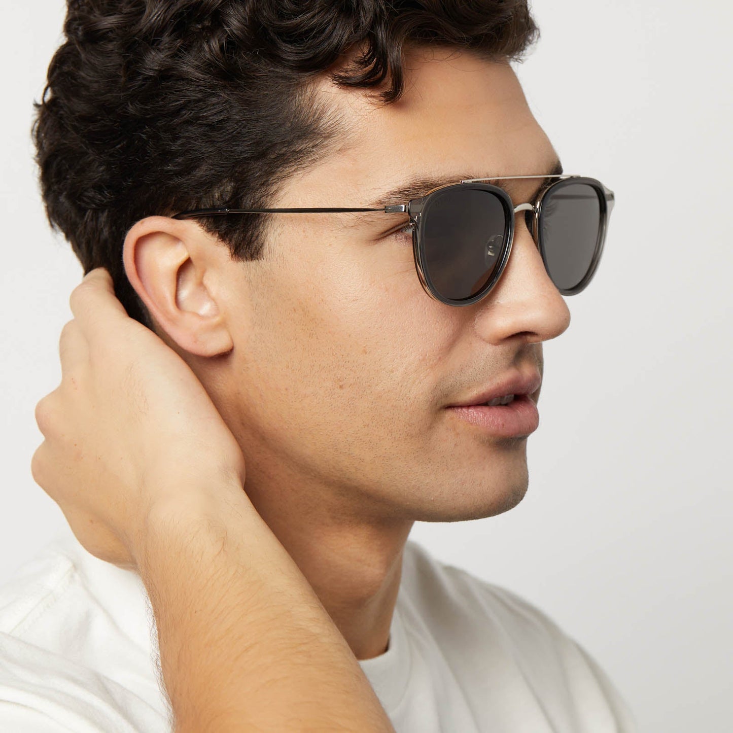 on model - male wearing diff eyewear featuring the camden aviator sunglasses with a black smoke crystal frame and grey polarized lenses side view