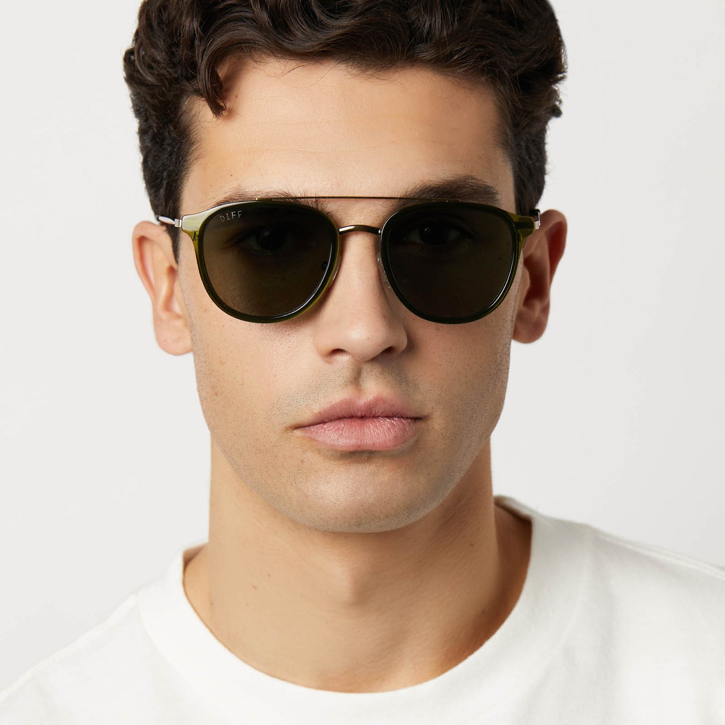 on model - male wearing diff eyewear featuring the camden aviator sunglasses with a dark olive crystal frame and g15 polarized lenses front view