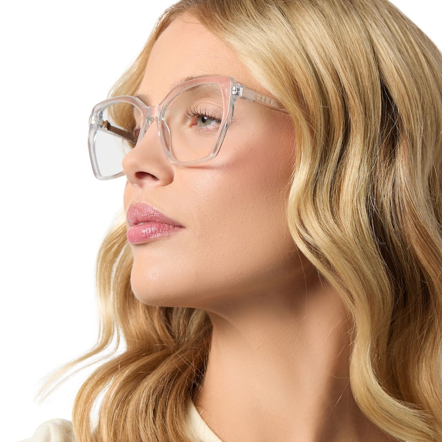 on model - female wearing diff eyewear featuring the maisie cateye glasses with a opalescent pink frame and prescription lenses side view