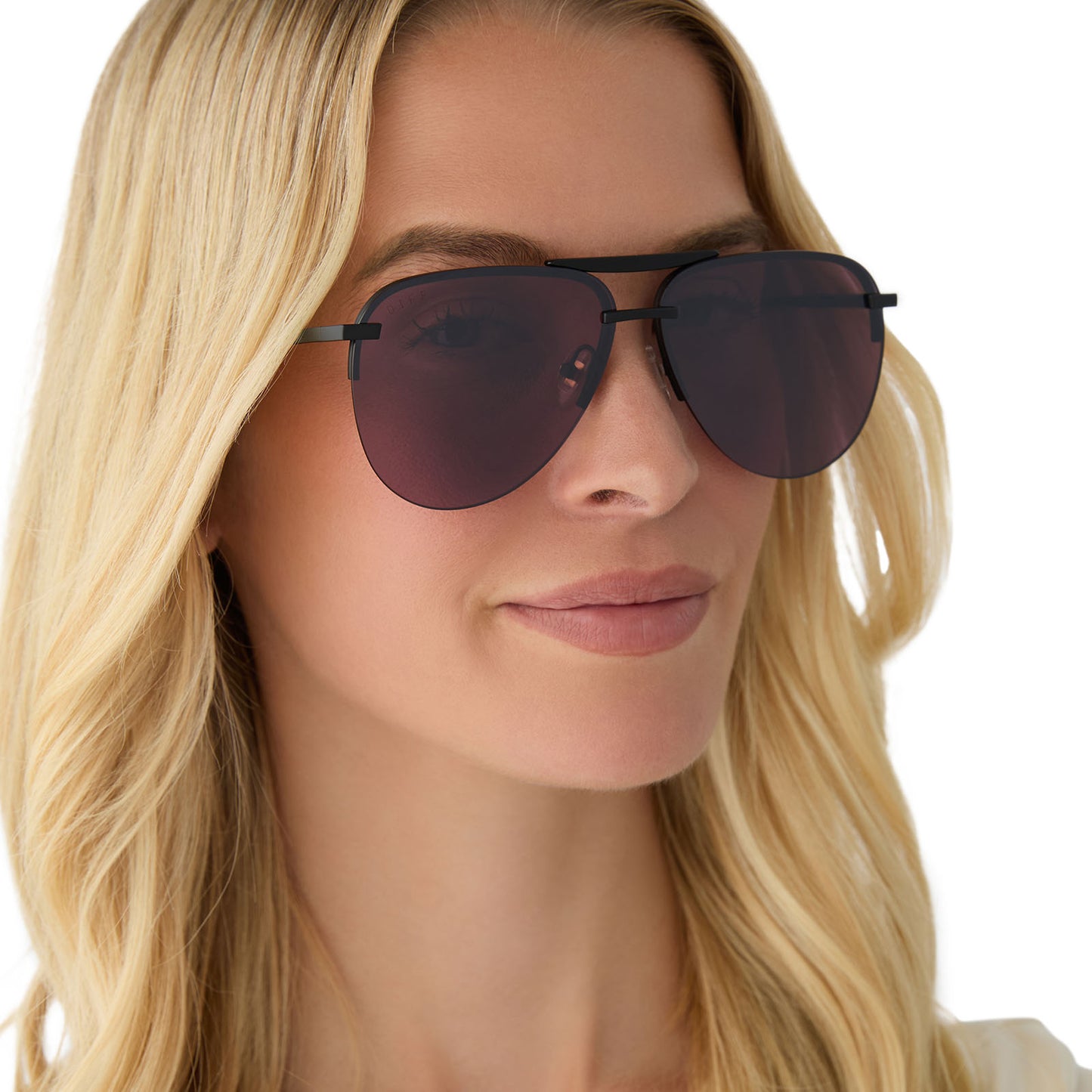 on model - female wearing diff eyewear featuring the tahoe aviator sunglasses with a matte black + black temple tips frame and aubergine with silver flash lenses angled view