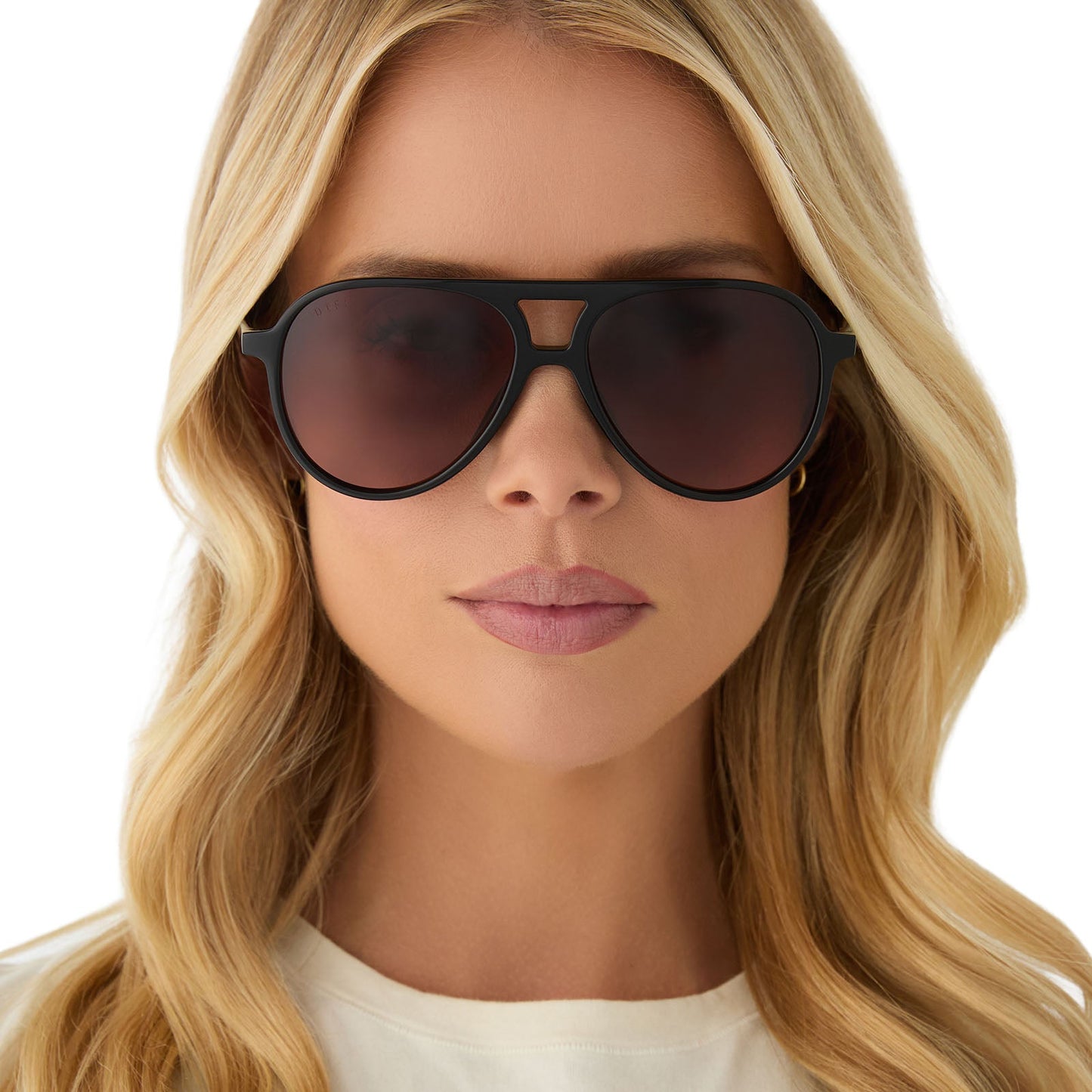 on model - female wearing diff eyewear featuring the tosca ii aviator sunglasses with a black frame and brown gradient lenses front view