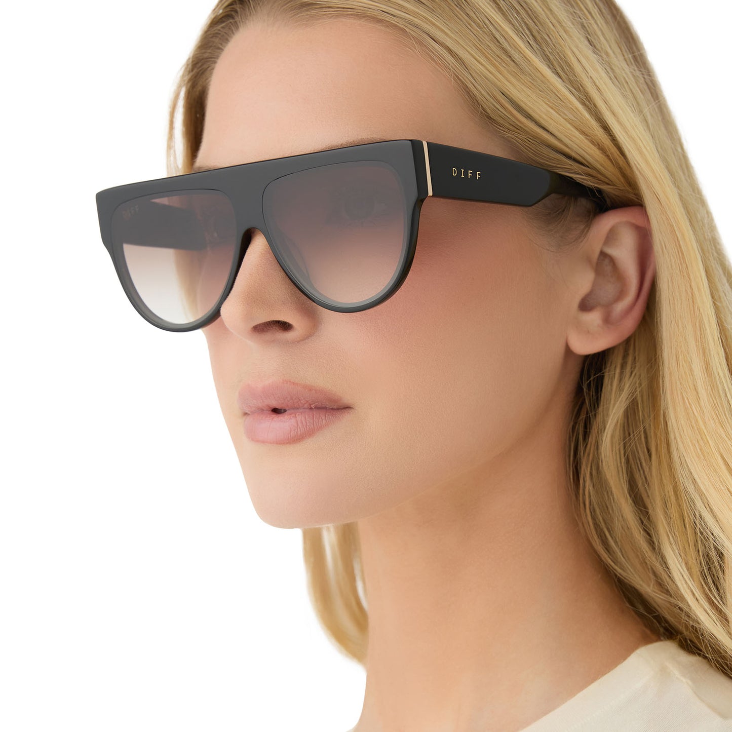 on model - female wearing diff eyewear georgie square sunglasses with a black frame and brown gradient lenses angled view