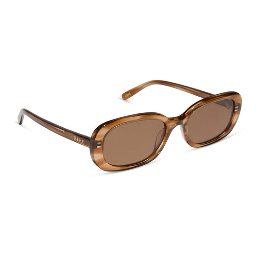 aspyn ovard x diff eyewear featuring the cove oval sunglasses with a tortoise frame and brown lenses angled view