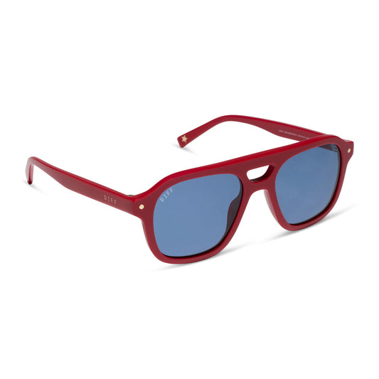 beach riot x diff eyewear the coast navigator sunglasses with a red acetate frame and navy blue lenses angled view
