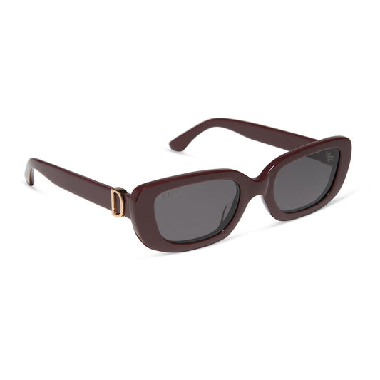diff eyewear featuring the daphne rectangle sunglasses with a rugby red acetate frame and grey polarized lenses angled view