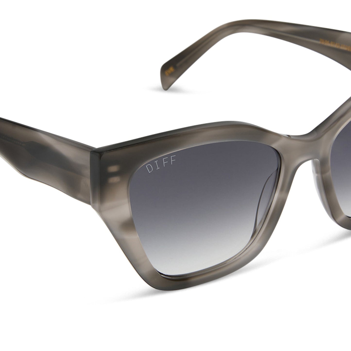 diff eyewear featuring the evie cat eye sunglasses with a smoke marble grey frame and grey gradient lenses angled view