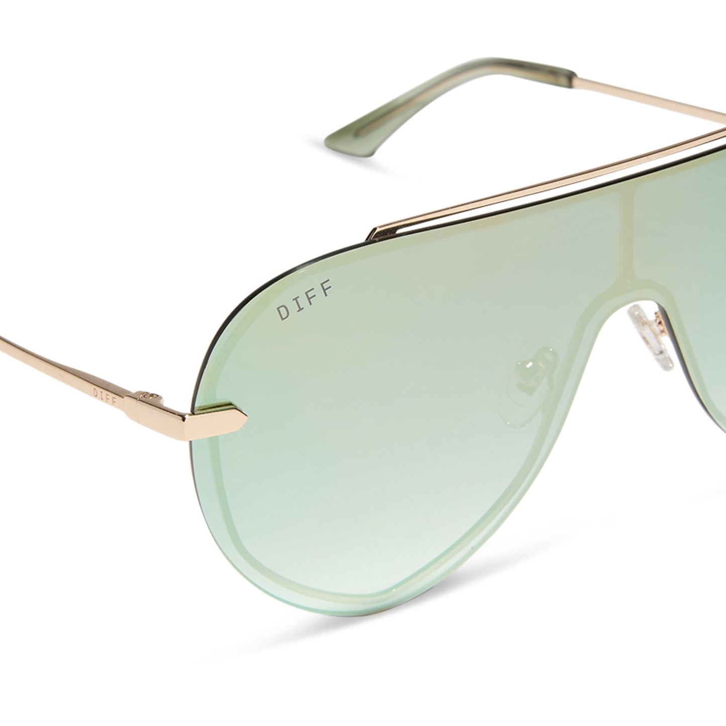 diff eyewear featuring the imani shield sunglasses with a gold frame and cool matcha green mirror lenses detailed view