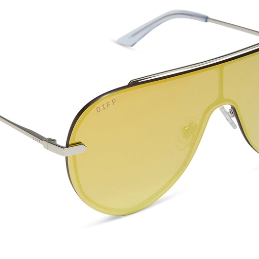 diff eyewear imani shield sunglasses with a silver frame and gold mirror lenses angled view